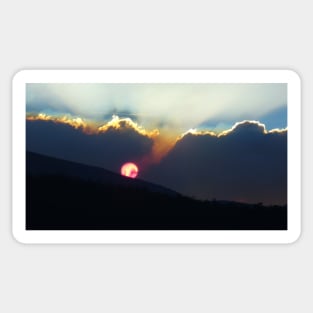 Red Sun Behind Smokey Clouds Sticker